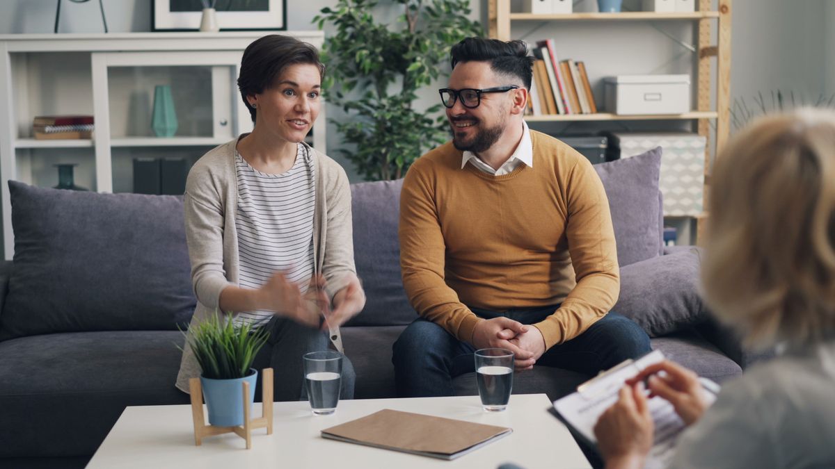 Two people talking through options together in a supportive conversation