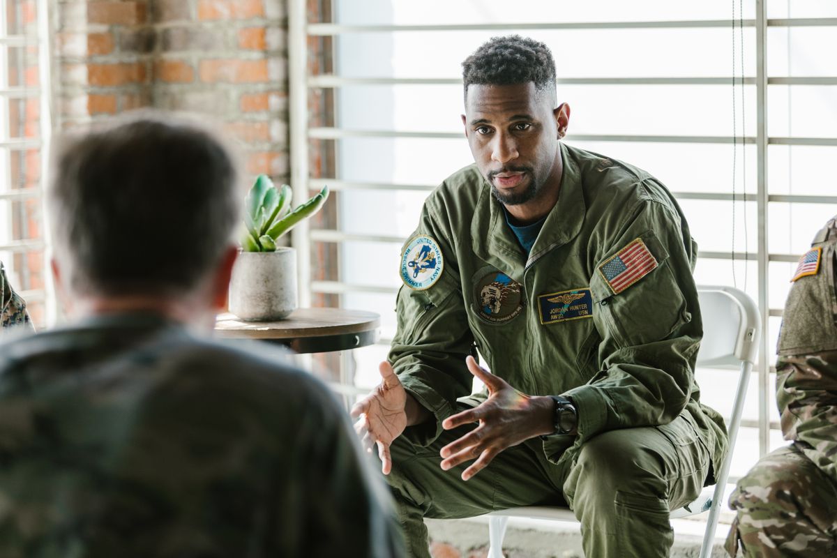 A veteran sharing with others in a supportive peer group